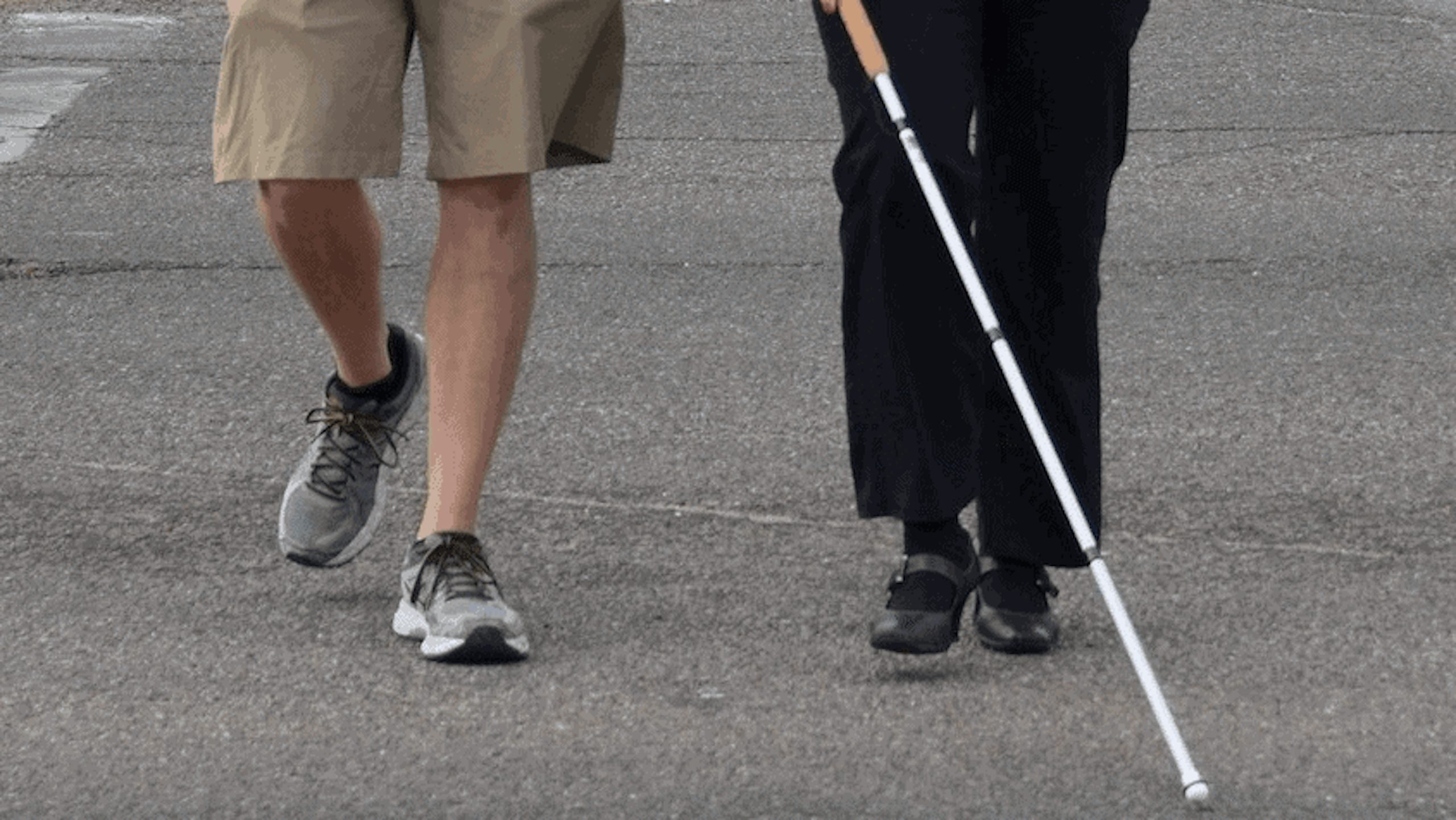 a blind person crossing the street