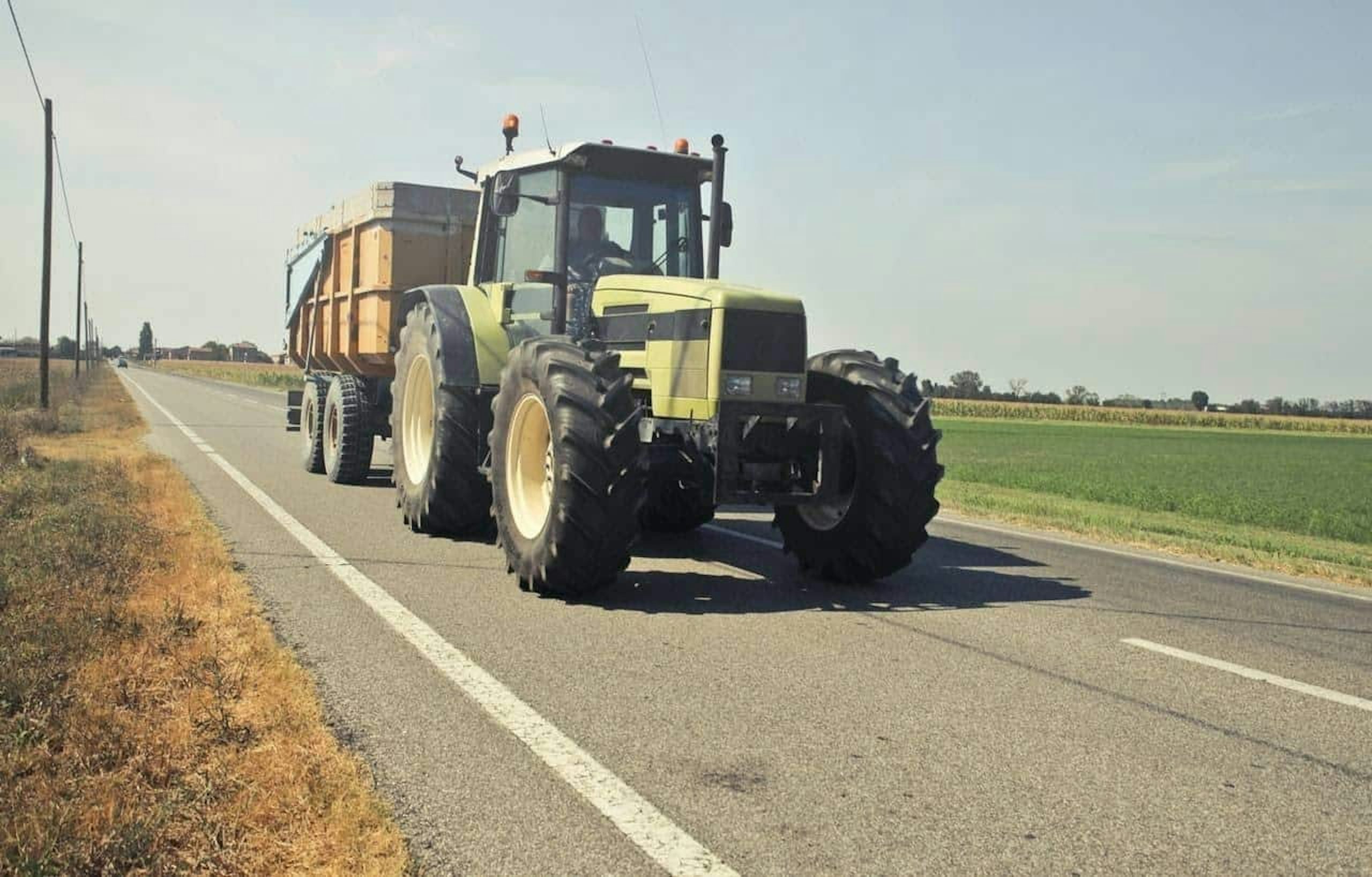 Slow moving vehicles, like tractors, may carry loads on the highway