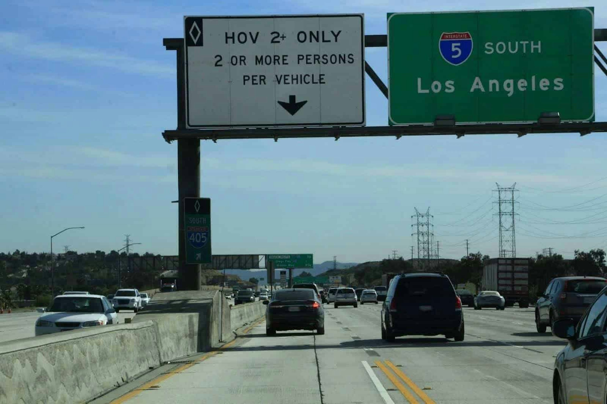 Look for signs indicating who may drive in a HOV lane